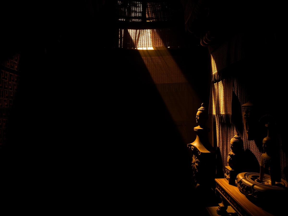 Heritage artifacts lit by a single shaft of warm light